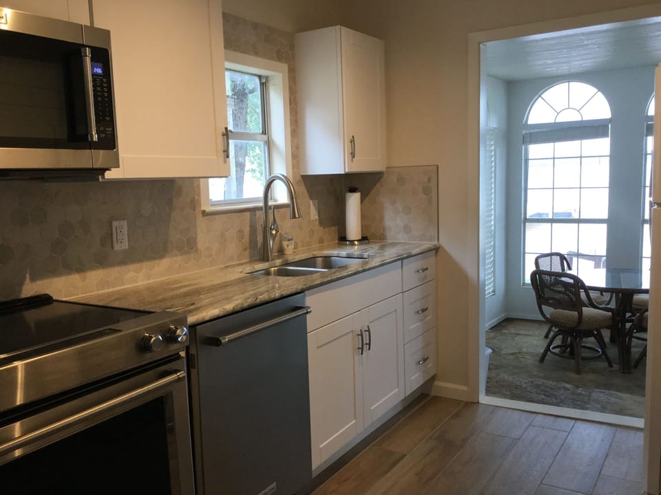 View of Sunporch and lake from the kitchen