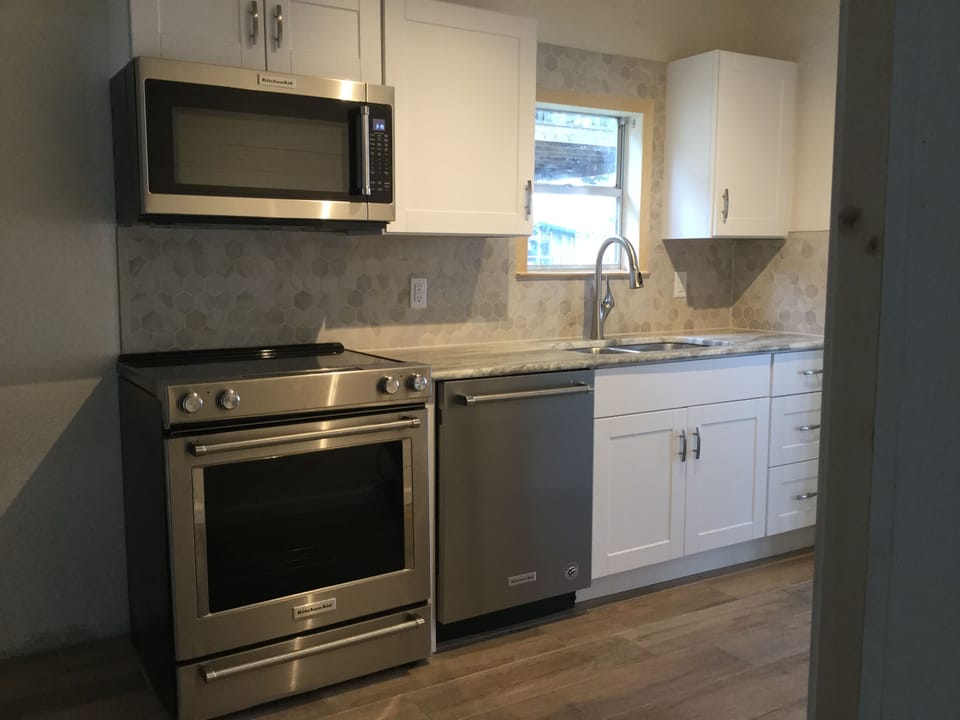 Newly renovated kitchen - stainless appliances, marble countertops, new tile
