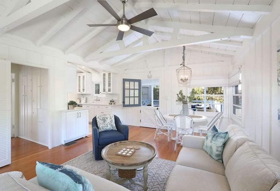 Living area with deck and main front door.  Upstairs