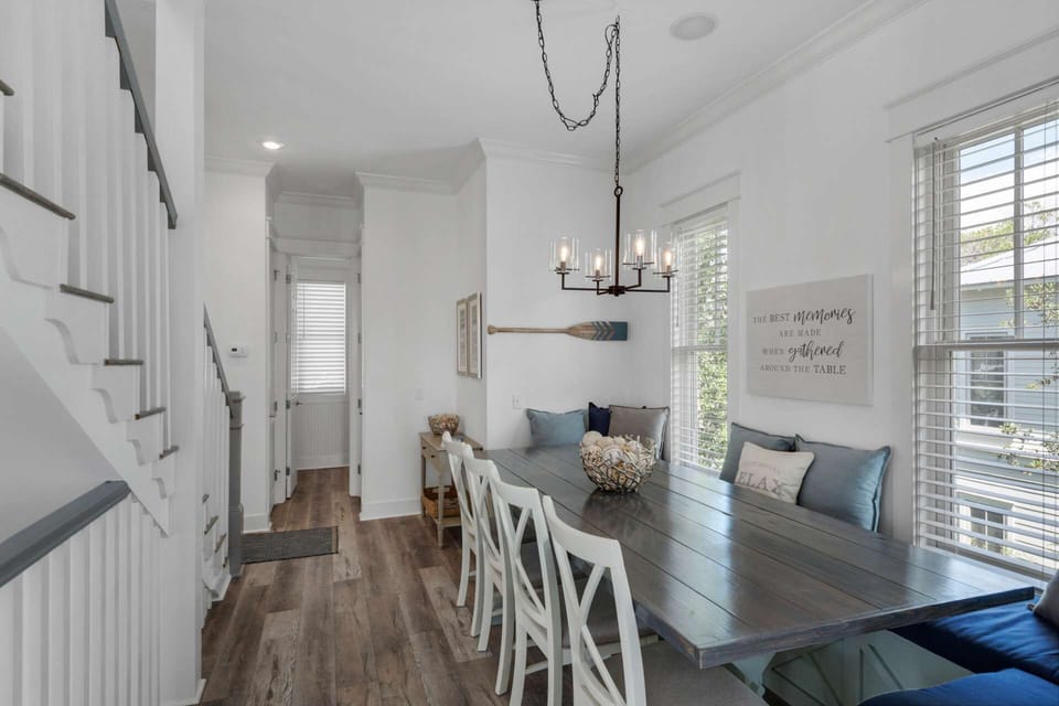 Large built-in dining room table is perfect for the entire group to enjoy mealtimes together