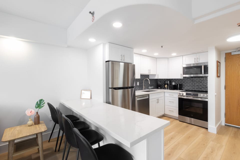 Cozy up to the bar or utilize the large counter space as a workstation
