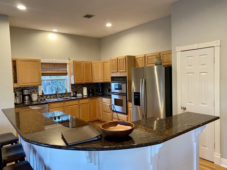 A fully-equipped kitchen and ample counter space make cooking a breeze.