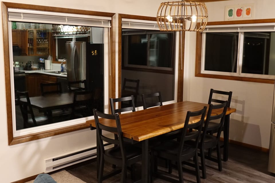 Dining room table seats 8. Another table downstairs seats 6 more. 