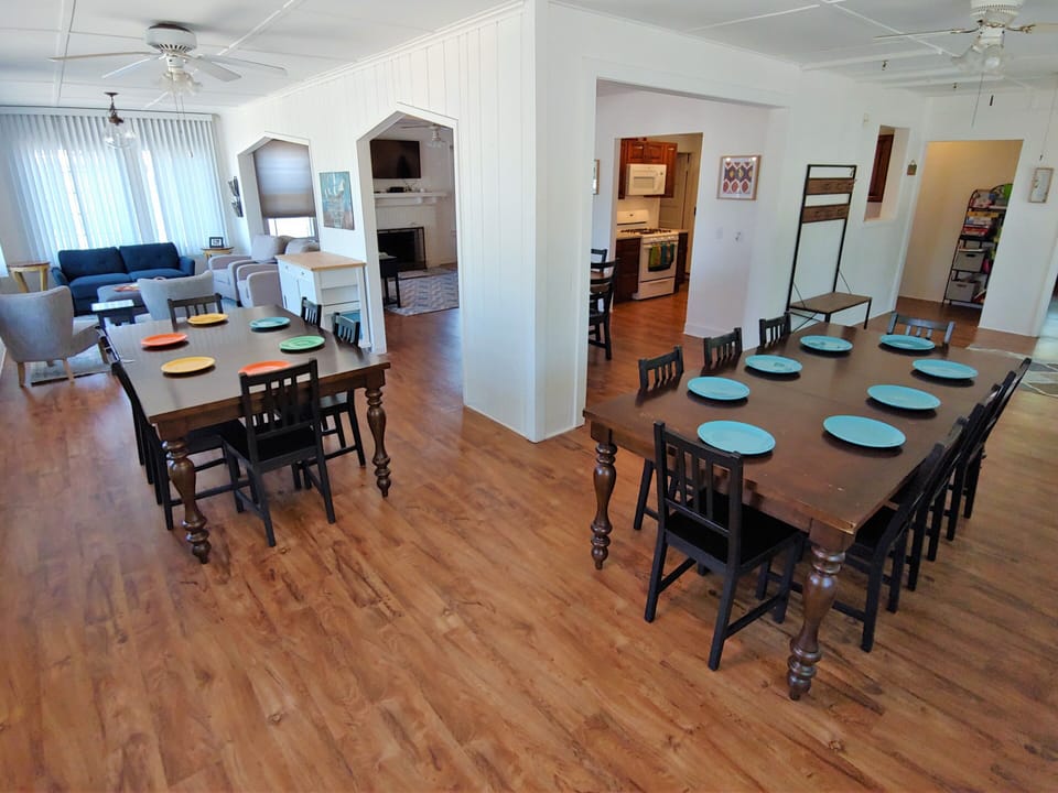 Dining room open to kitchen and seating areas.
