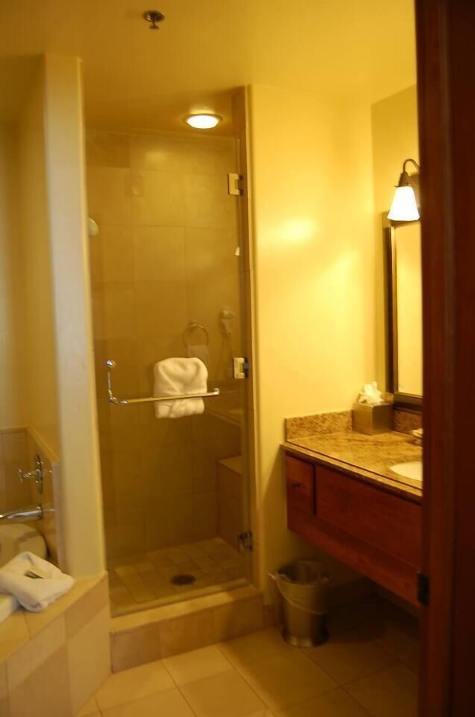Master ensuite bath features separate freestanding shower and whirlpool tub.