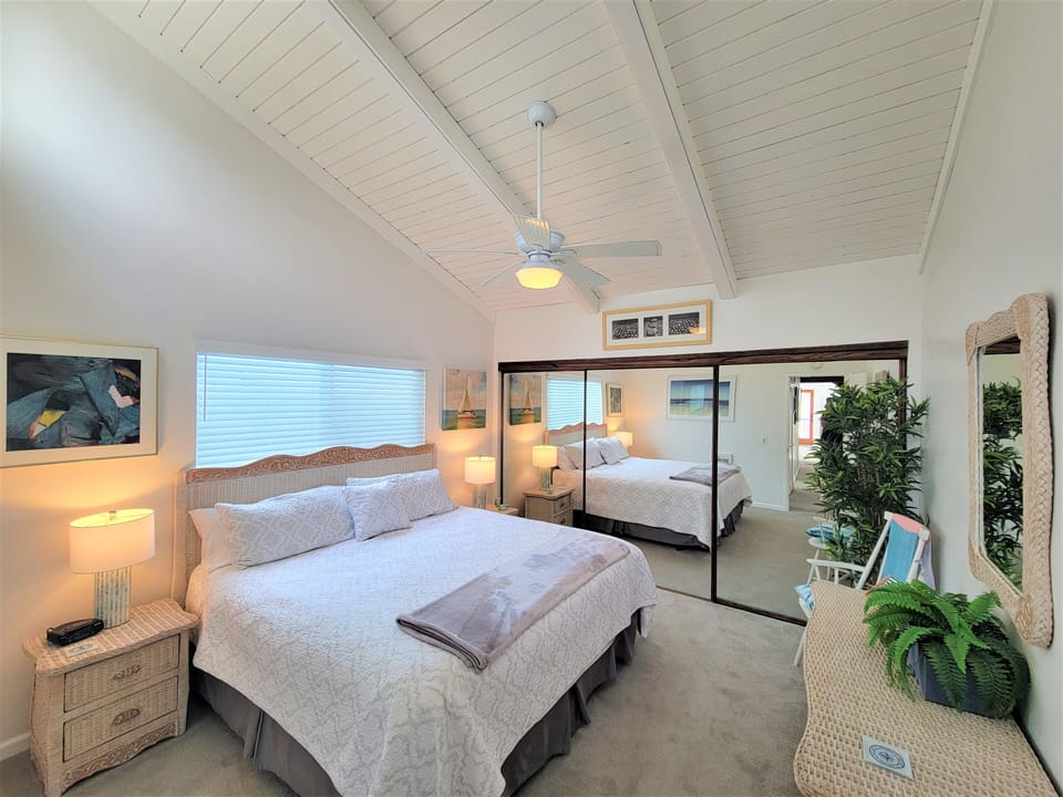 SECOND GUEST BEDROOM WITH VAULTED CEILINGS AND NEW BED AND BEDDING...