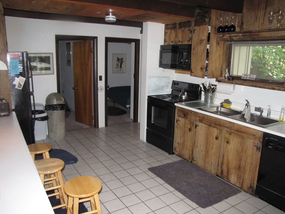 Fully applianced kitchen (view of 2 1st fl bdrms & full bath)