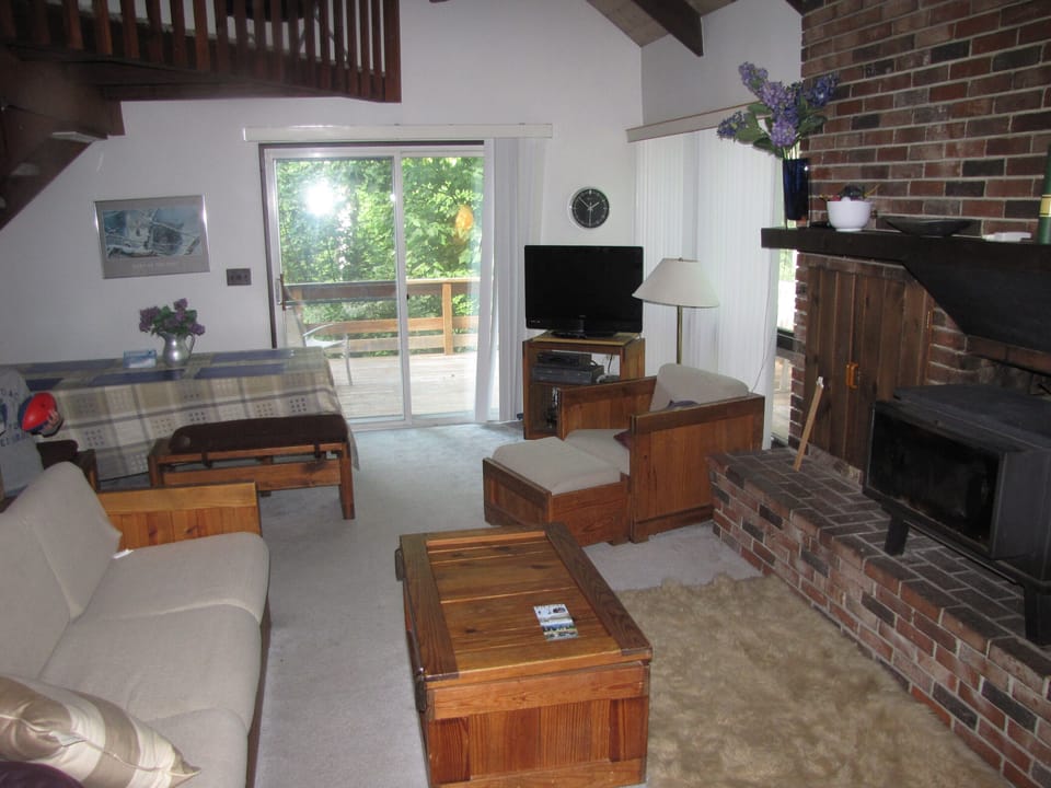 Living dining area + view to wrap-around deck