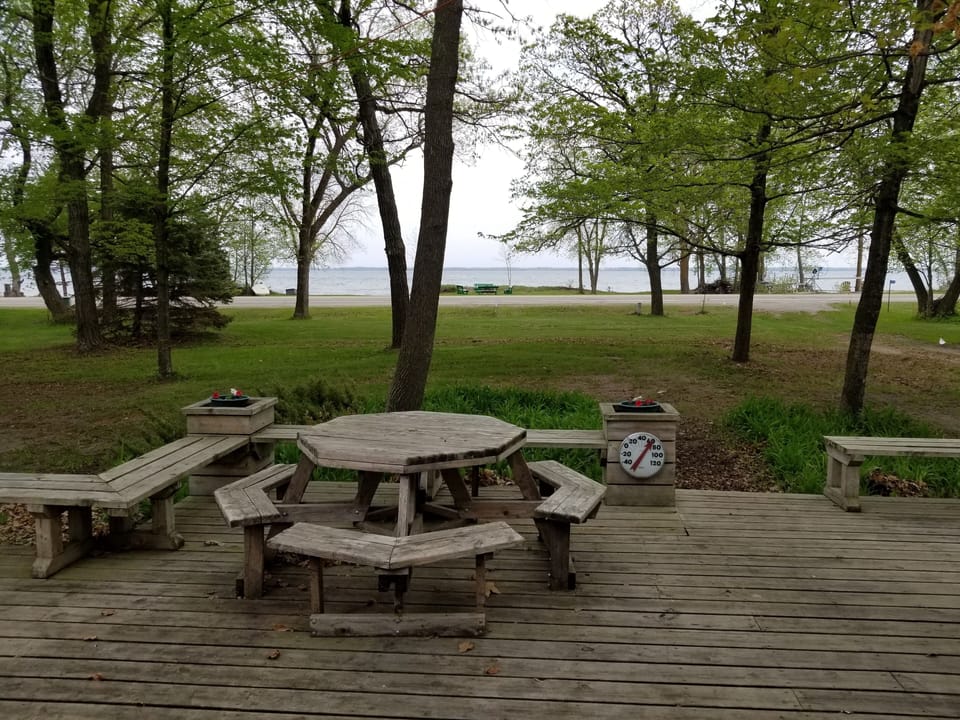 Large front yard, room for yard games, great lake view, huge deck, private drive
