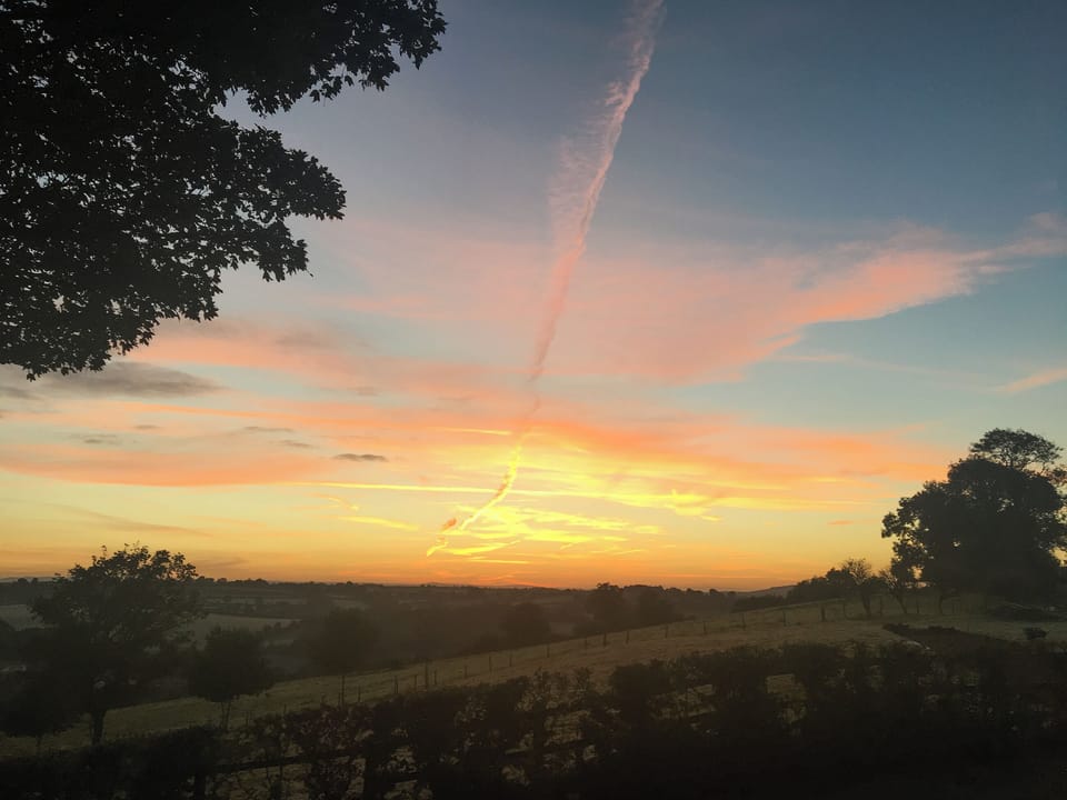Beautiful sunset over the surrounding landscape | Trezeal Barn, North Hill