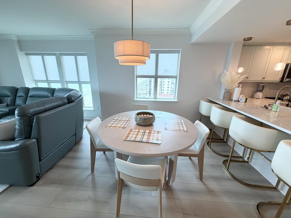 Bright, open dining and living area with cozy seating