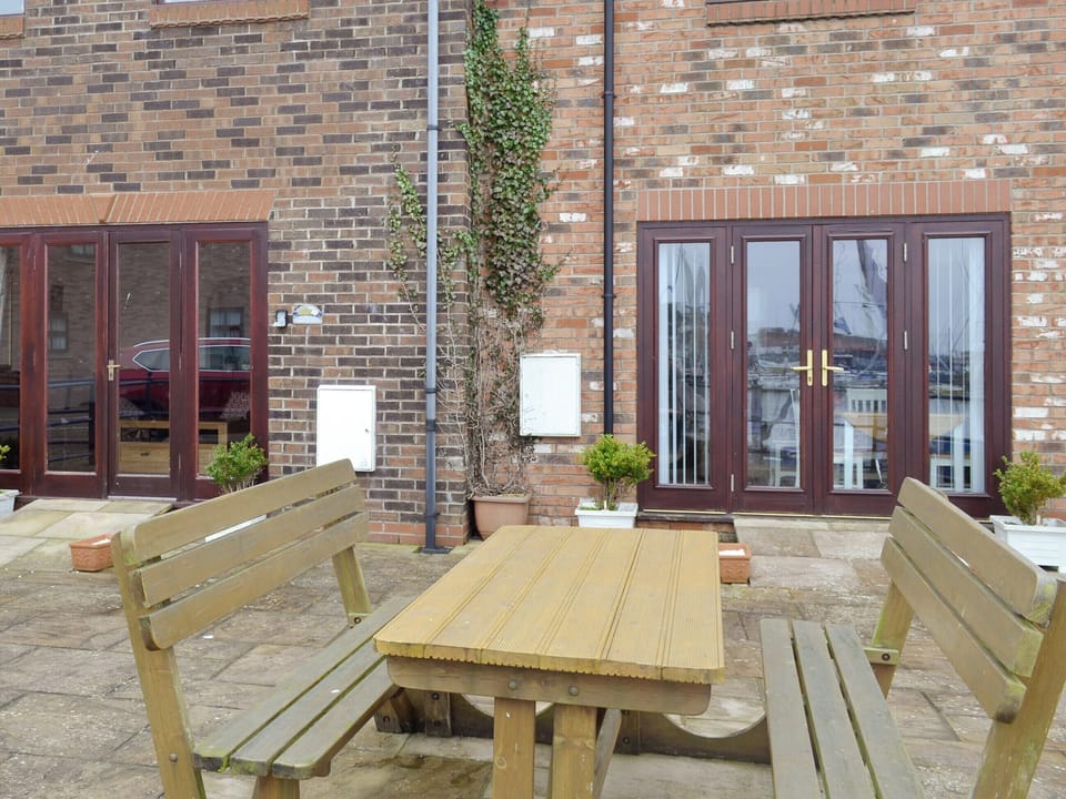 Patio with outdoor furniture | Moon River Cottage, Whitby