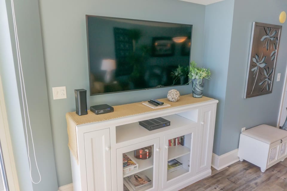 Cozy living room with stylish media console and calming decor
