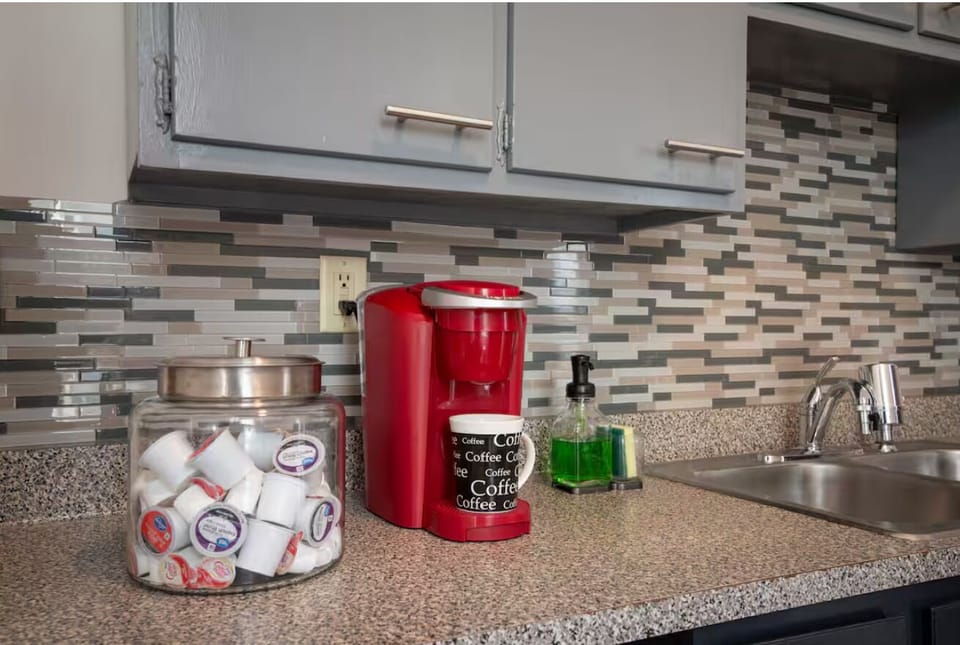 Keurig coffee maker with complimentary coffee pods and snacks!