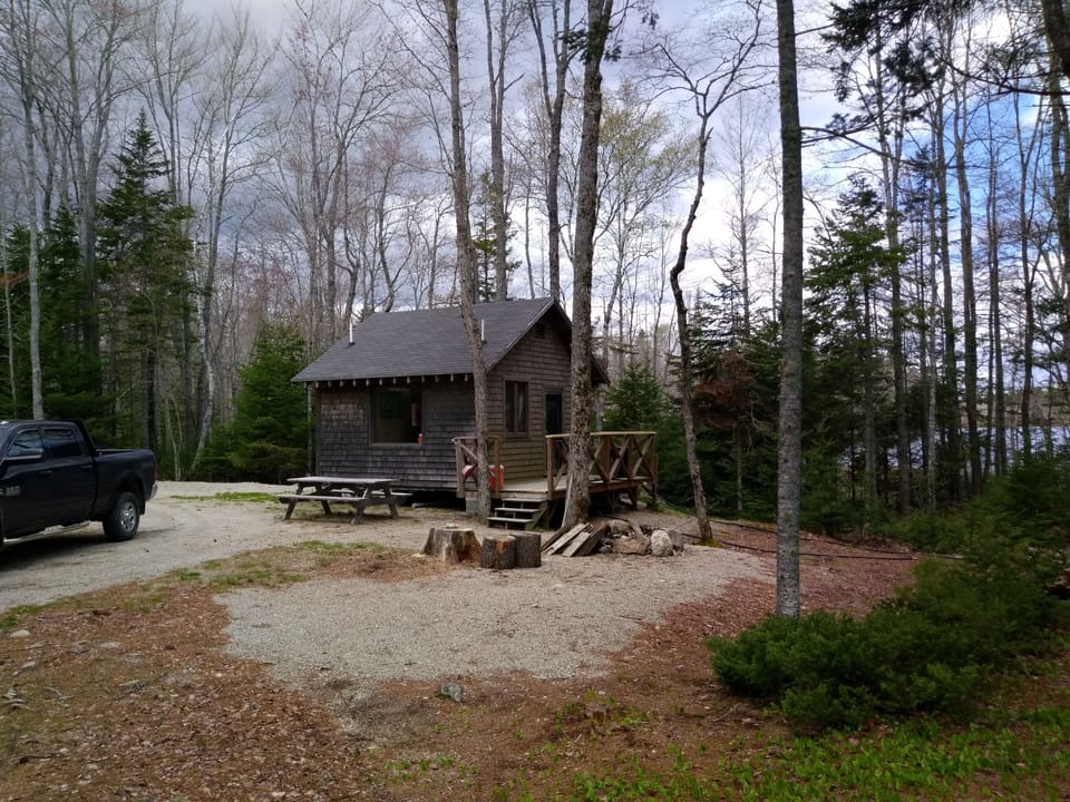 Outhouse/Privy located behind the camp.  