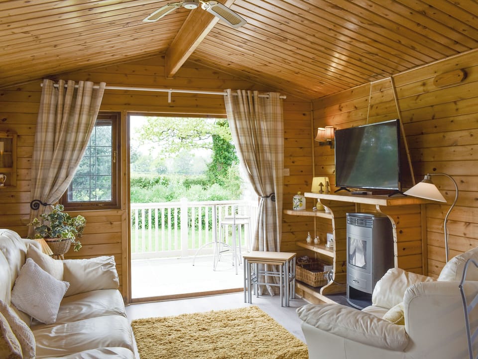 Living area with door to terrace | Llama Lodge, Churchstanton, near Honiton