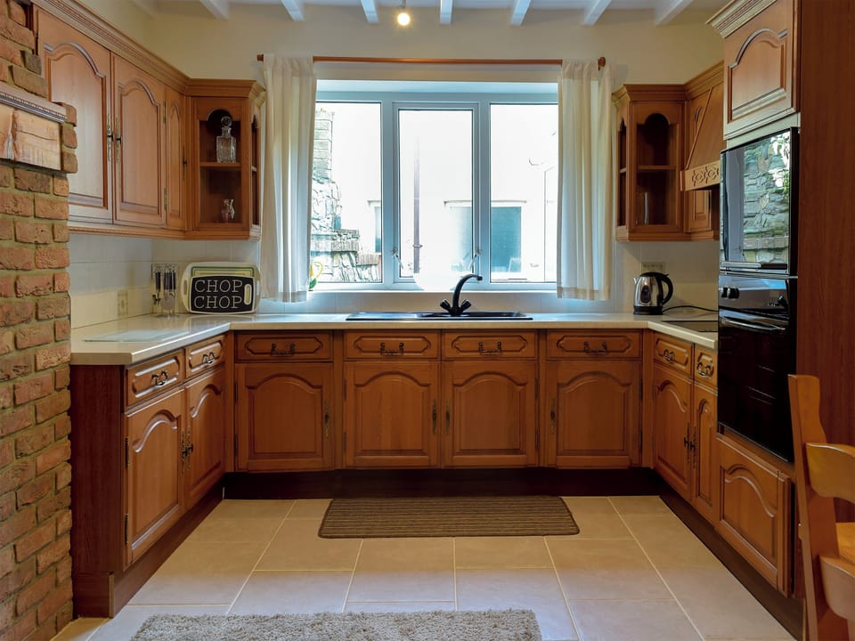 Farmhouse style kitchen with breakfast area | Yorke Villa, Fishguard