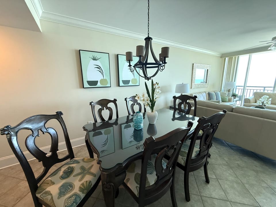 Elegant dining room with classic chandelier and natural light