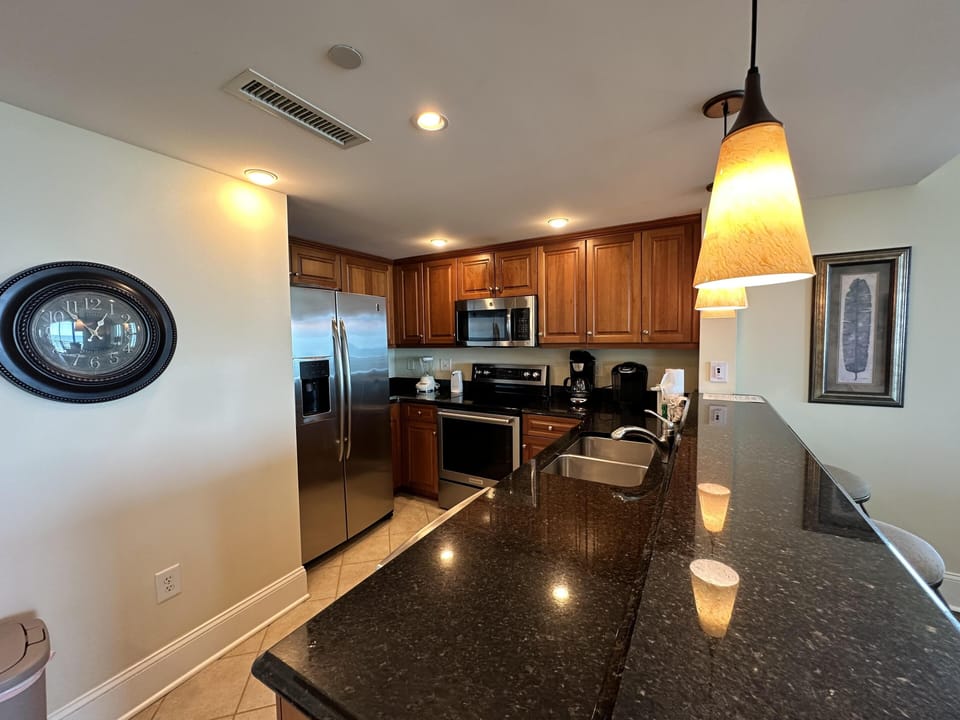 Modern kitchen with granite countertops and stainless steel appliances