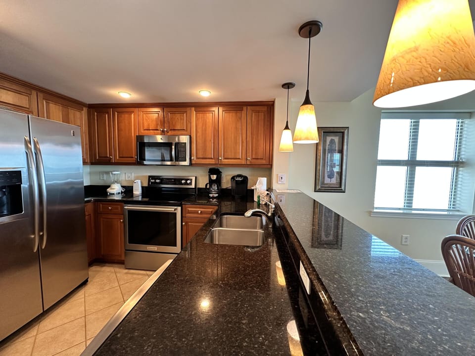 Modern kitchen with granite countertops and stainless steel appliances