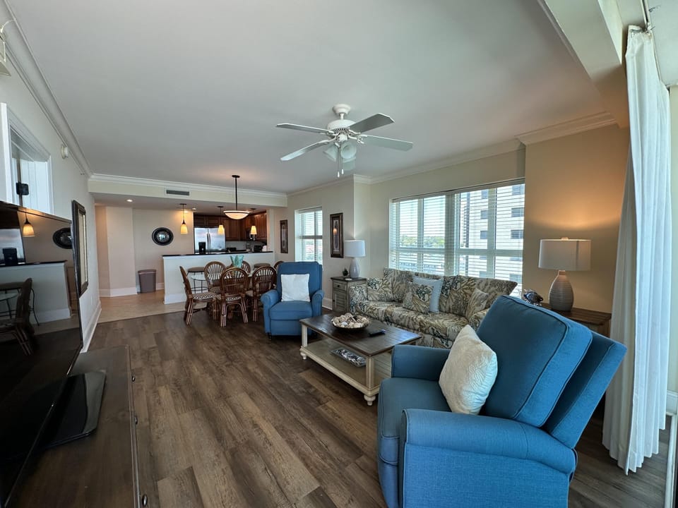 Spacious open living area with cozy seating and natural light