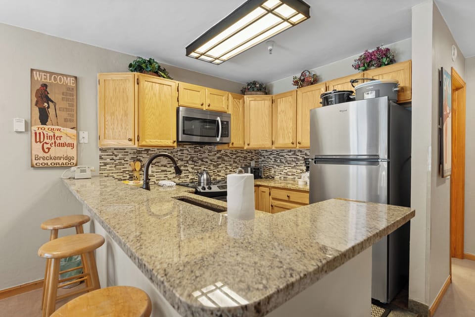 Your fully-equipped kitchen features granite counters, stainless appliances, and everything you need to prepare meals during your mountain getaway.