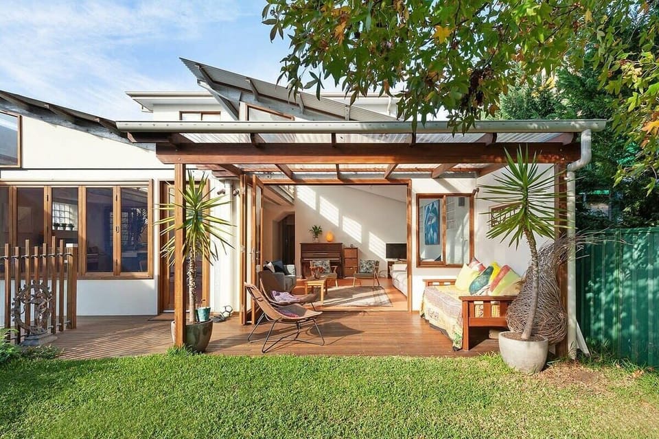 The backyard is furnished for entertaining with the family