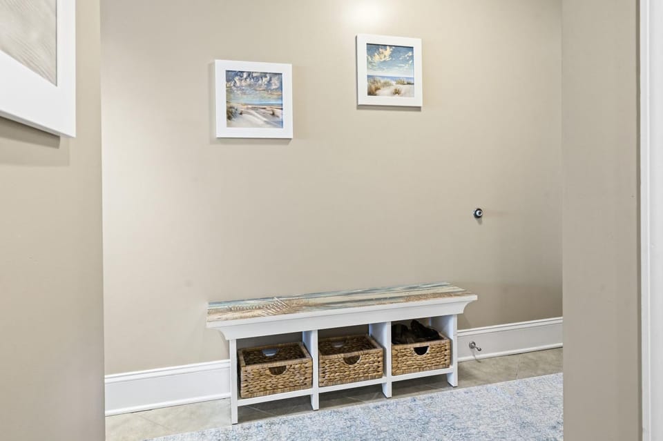 Entryway with organized storage and warm lighting