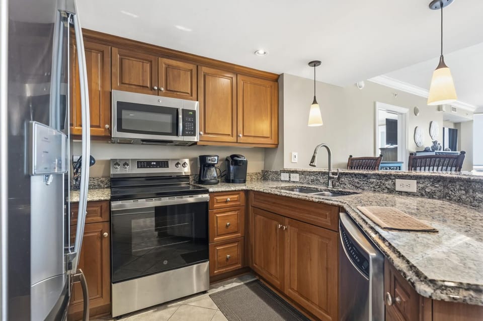 Modern kitchen with granite countertops and stainless steel appliances