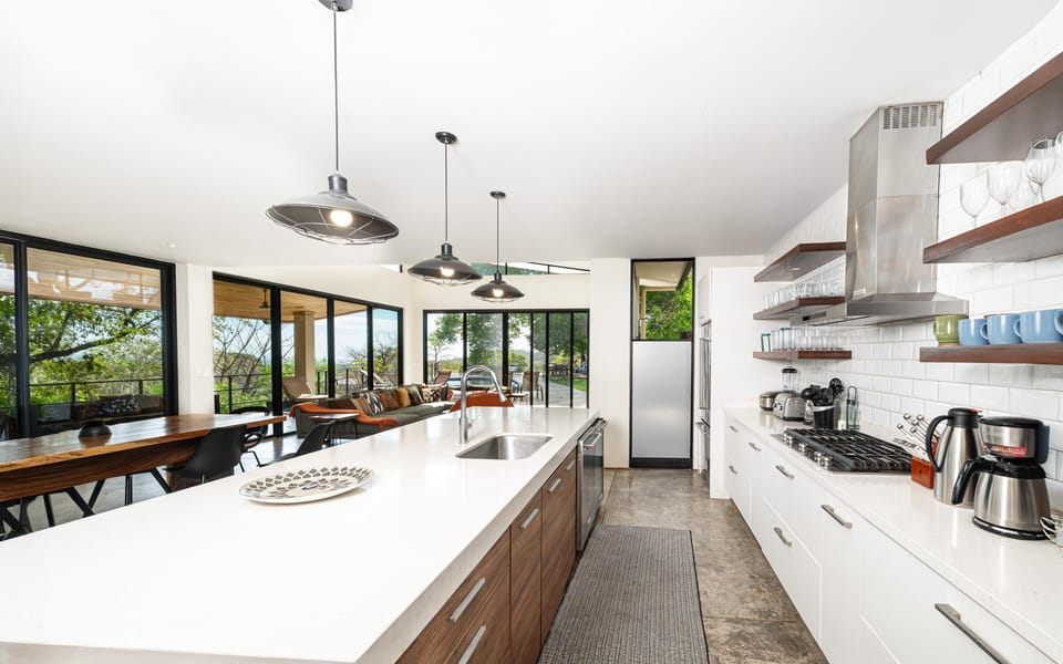 Spacious modern kitchen with panoramic garden views