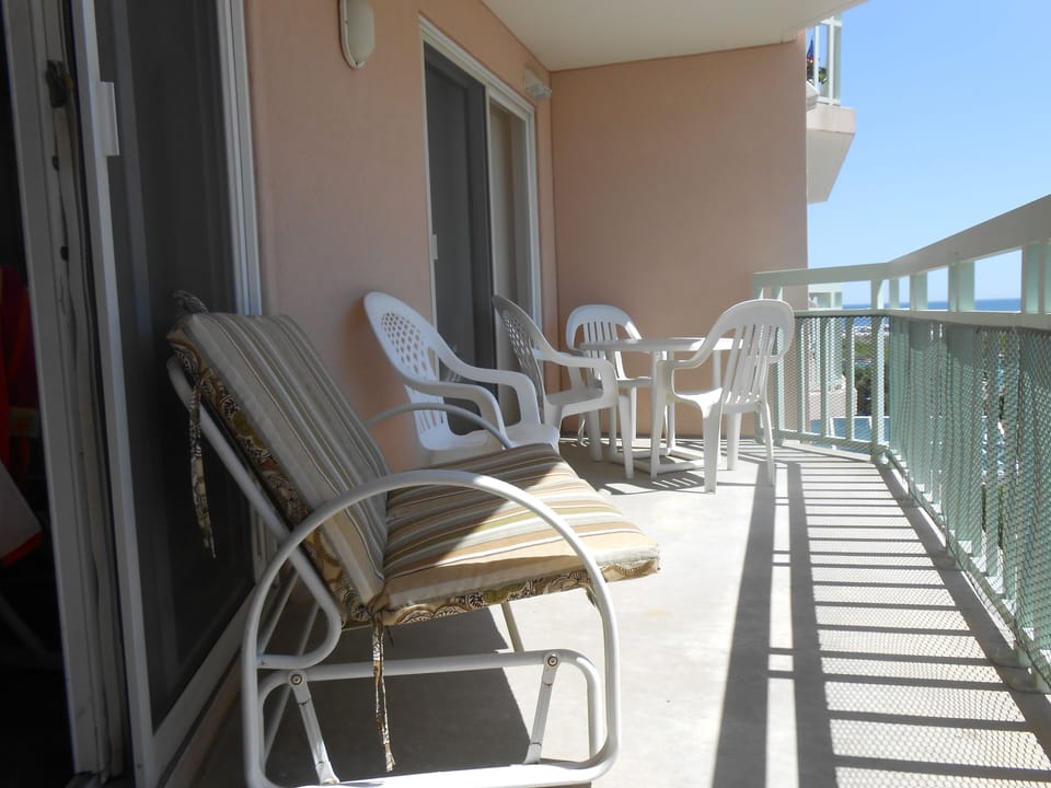 balcony has 2person slider, 4 person table/chairs and bar height bistro for 2.