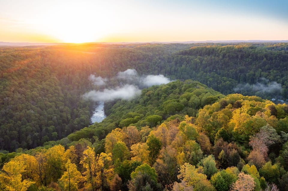 Explore Fayetteville’s Highlights - Dine at the famous Secret Sandwich Society, hike nearby trails, and experience thrilling activities like whitewater rafting and zip-lining at Adventures on the Gorge, all just minutes away.