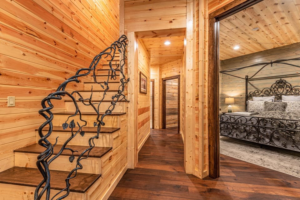 The staircase to the second floor features an intricate hand rail.