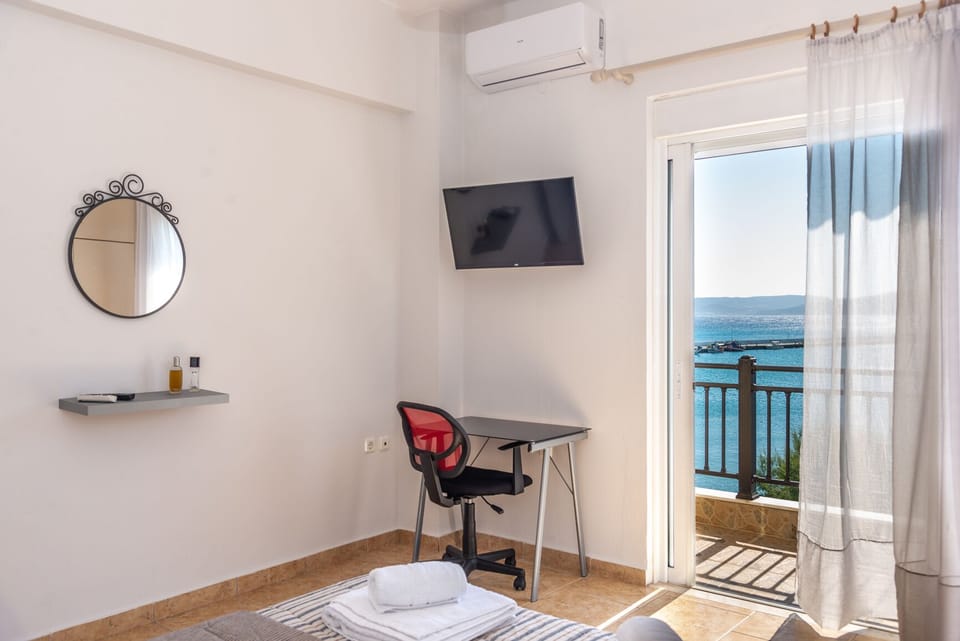 The spacious bedroom offers uninterrupted sea view, ample storage and a laptop friendly work space