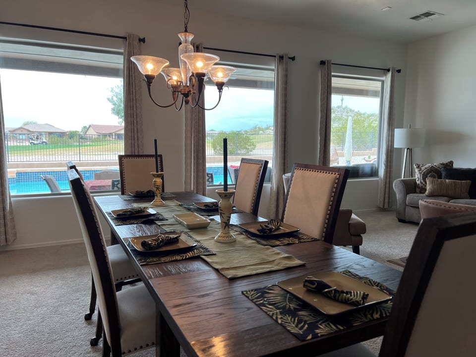 Large formal dining room with views of the backyard.