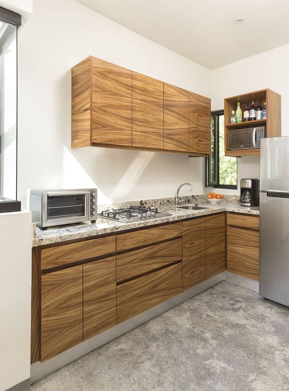 Kitchen view, parota woodwork, micro, mini oven, fridge, we provide safe water