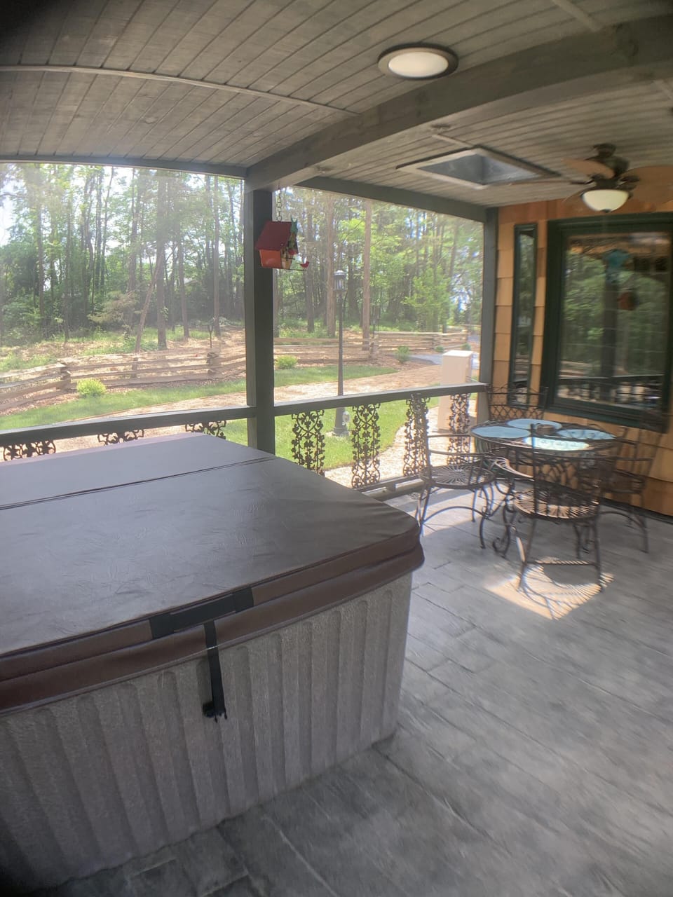 hot tub screened in porch seating area