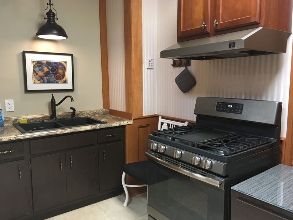 Private full kitchen has gas stove with oven.  Cook your own!
