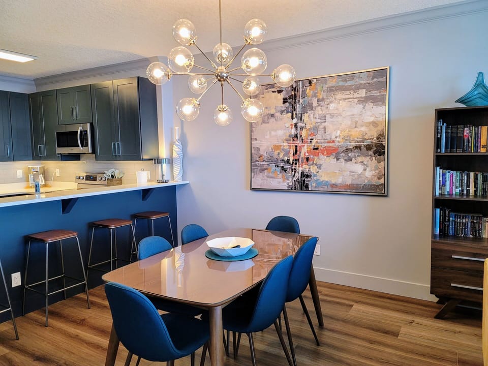 The gorgeous new sputnik light brightens up the dining table with seating for 6!