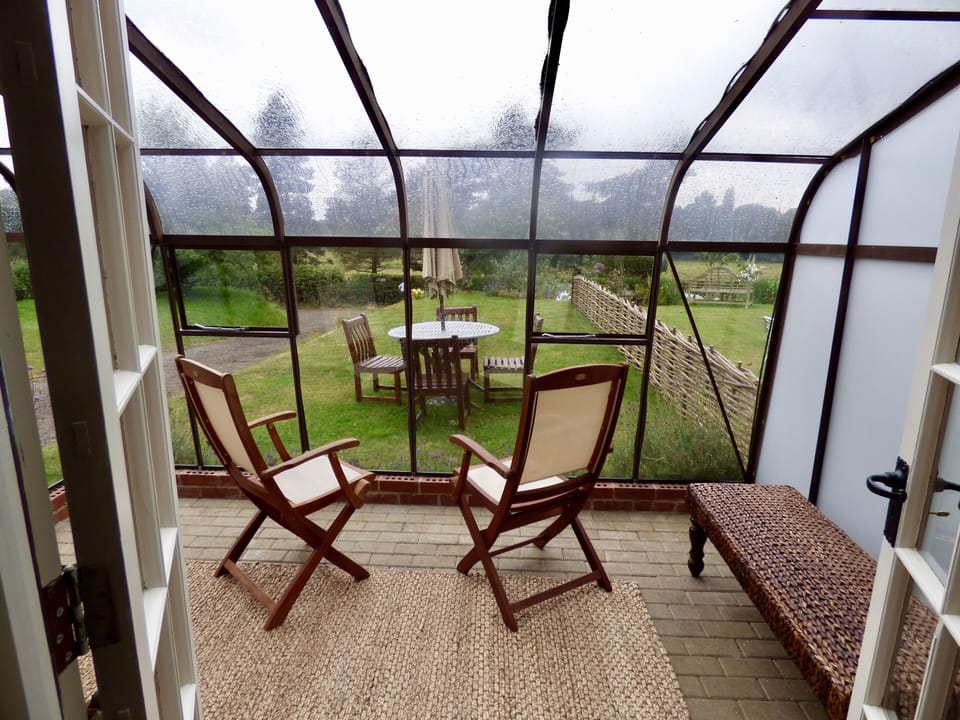 The retro Crittall conservatory is a great place to enjoy a glass of wine or two