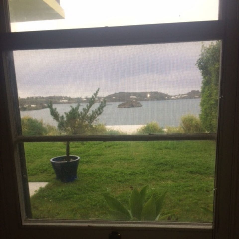 view from bed in bedroom on a rainy day