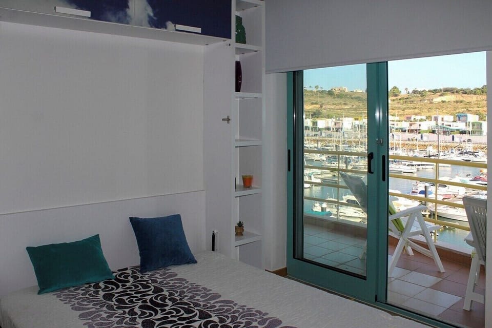 Removable room with a double bed, air conditioning and access door to balcony and pool