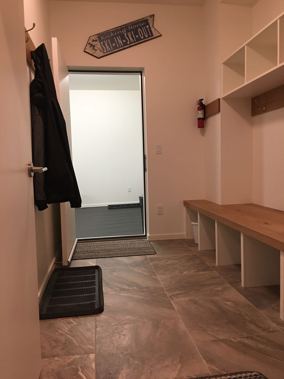 Easy access to garage, boot dryer, and entertainment area.