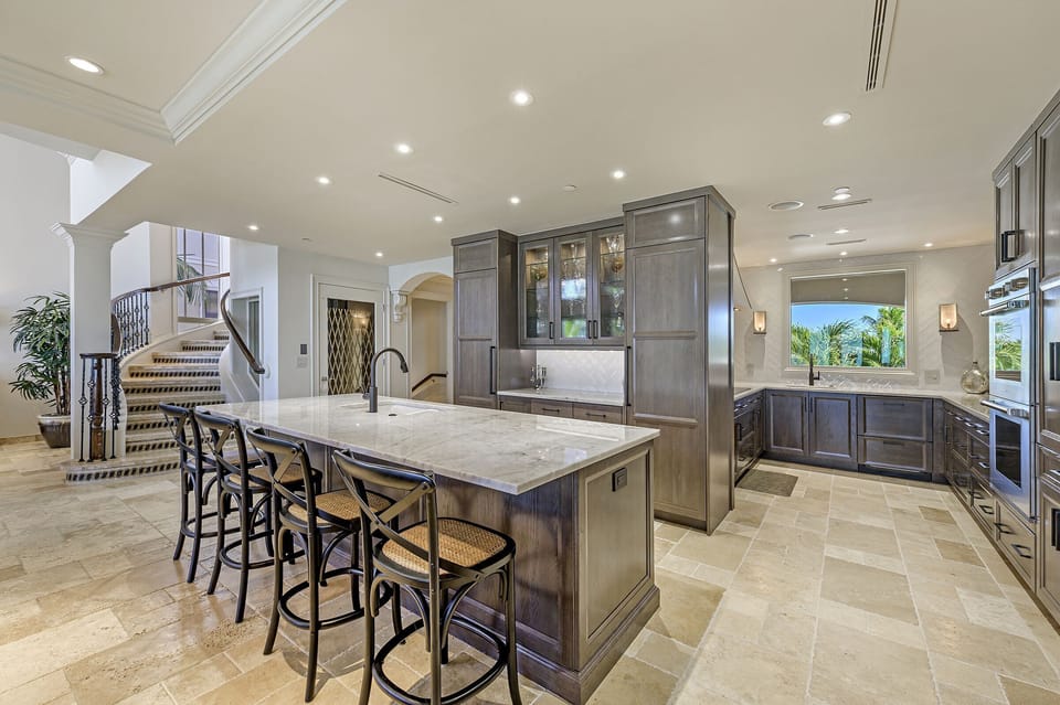 Large Island with ice maker behind for beverage center.