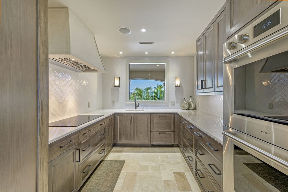 Double oven, cook top w/stone exhaust above, sink and double drawer dishwasher!