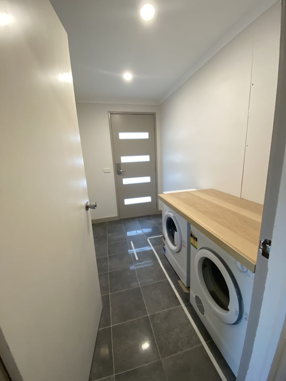 Washer and dryer in shared entry space