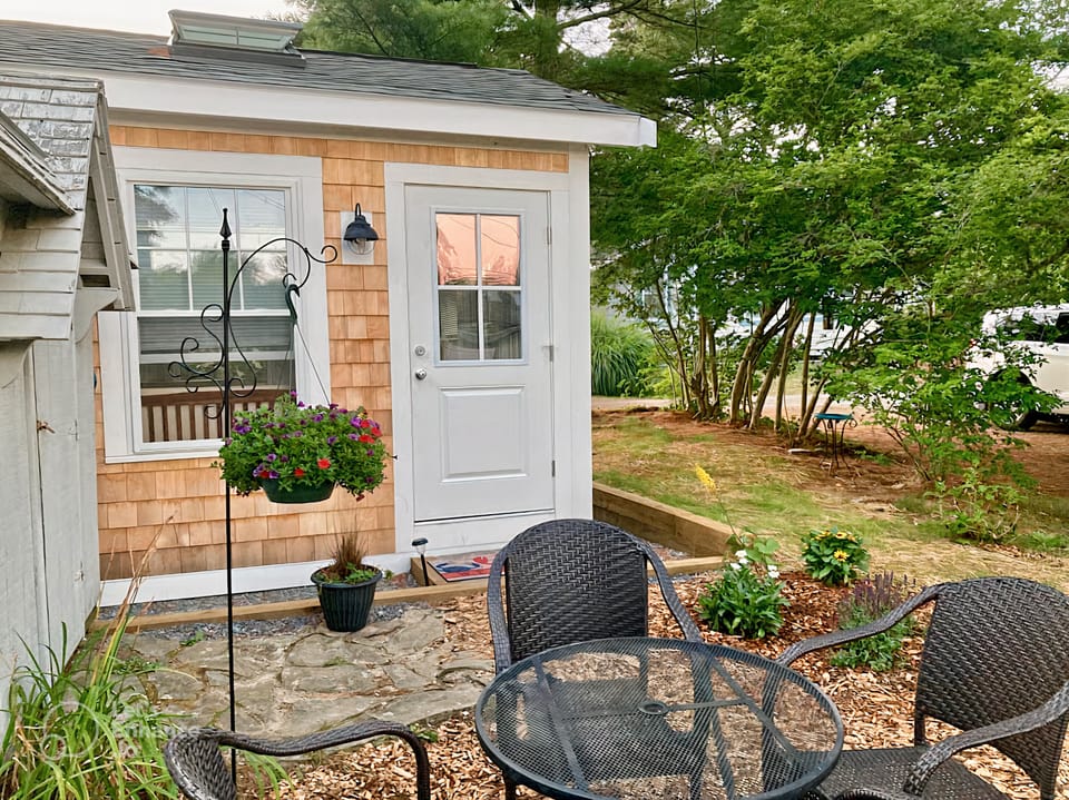 Outdoor seating area to enjoy nature, bird watching, or morning coffee 