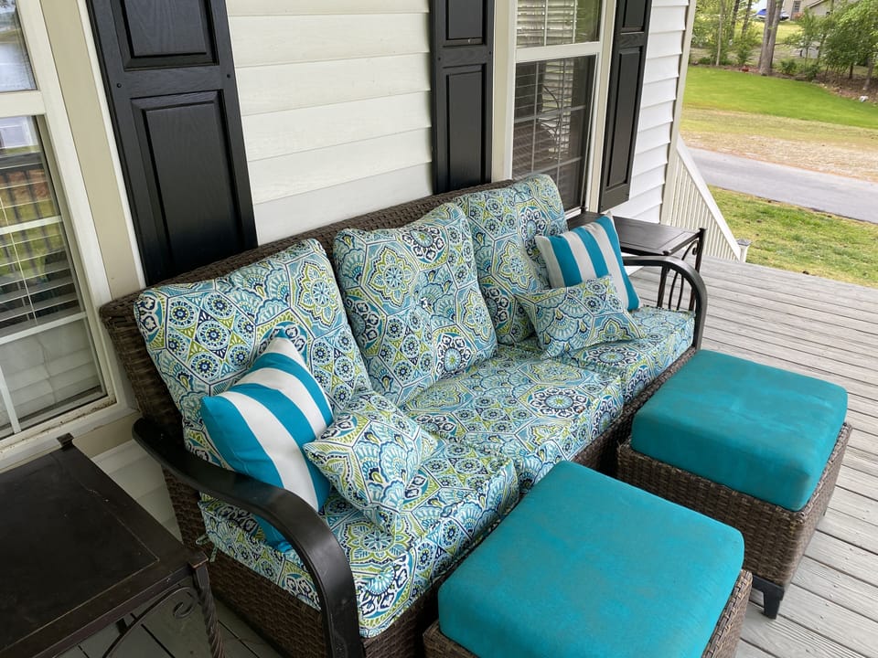 Cozy seating area on upper level porch 