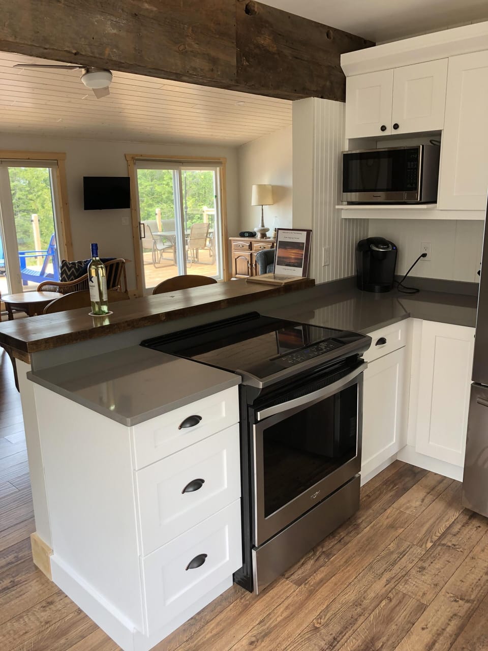 New stainless-steel appliances, breakfast bar and reclaimed Ontario wood accents