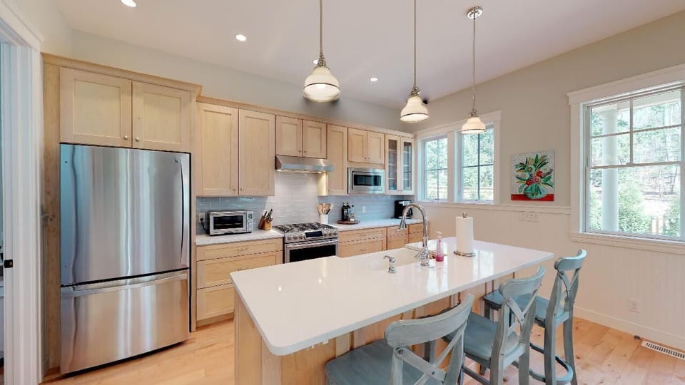 Chef's Kitchen with Quartz Countertops and Stainless Appliances